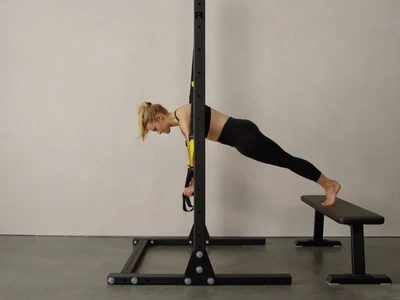 The 7 Advanced TRX Exercises to Add To Your At Home Workouts Thumbnail Image