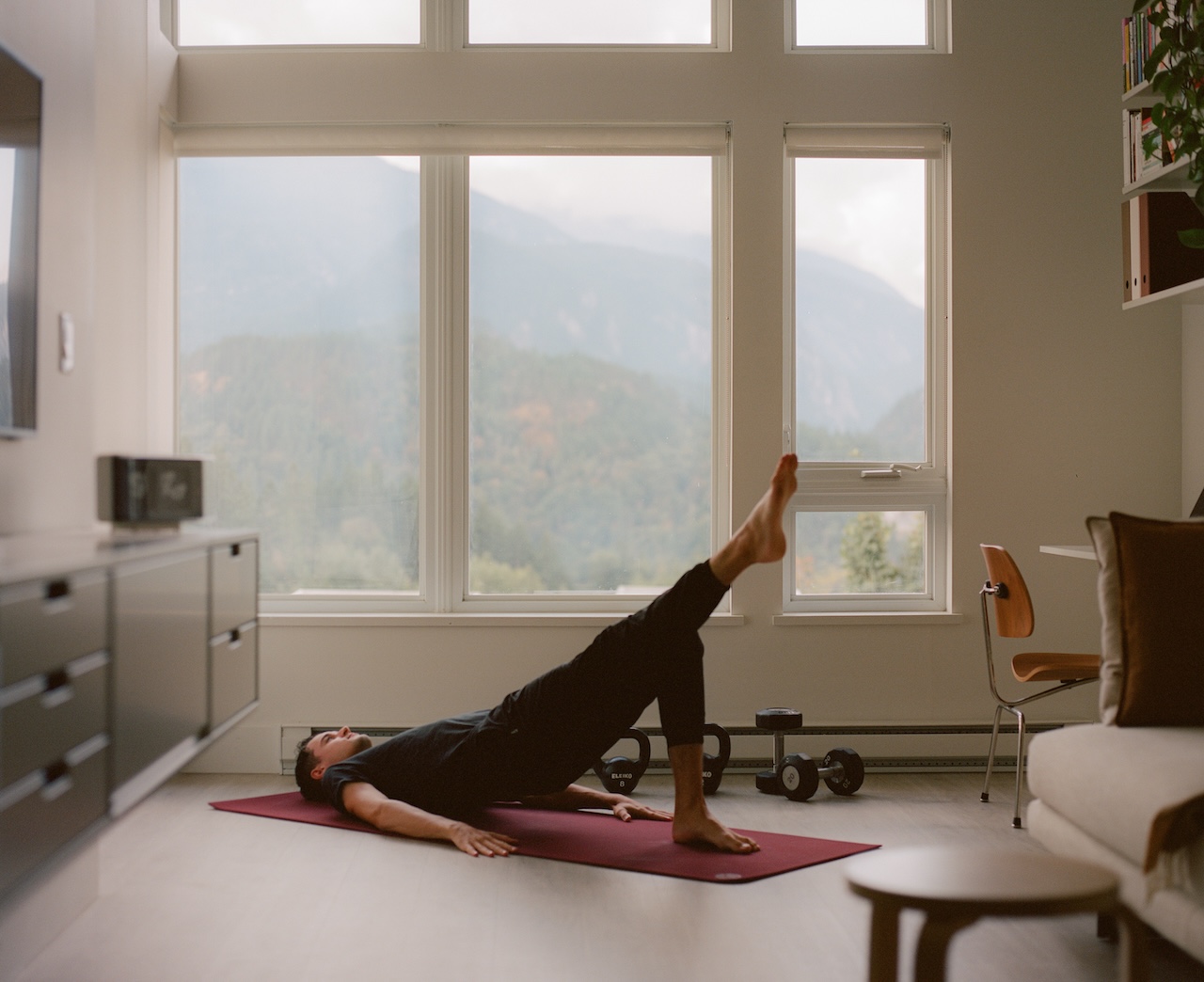 A man strength training in an apartment